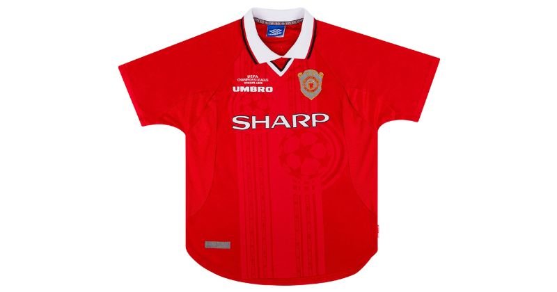 red manchester united champions league home shirt from 1997-2000 with champions league ball pattern on the shirt background